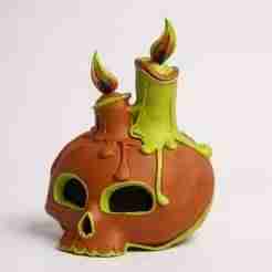 Vintage halloween skull head statue with candles